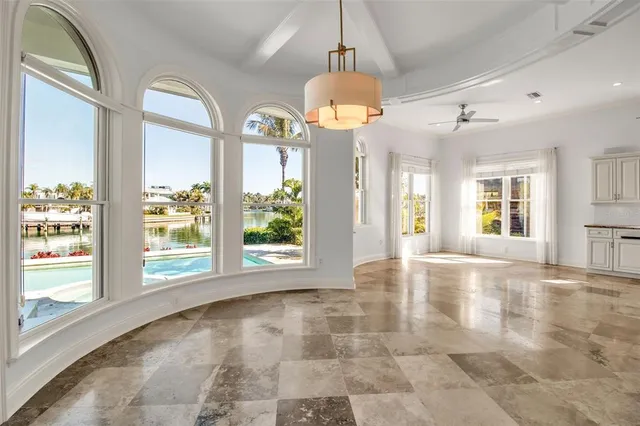a kitchen with kitchen island granite countertop lots of counter top space and stainless steel appliances