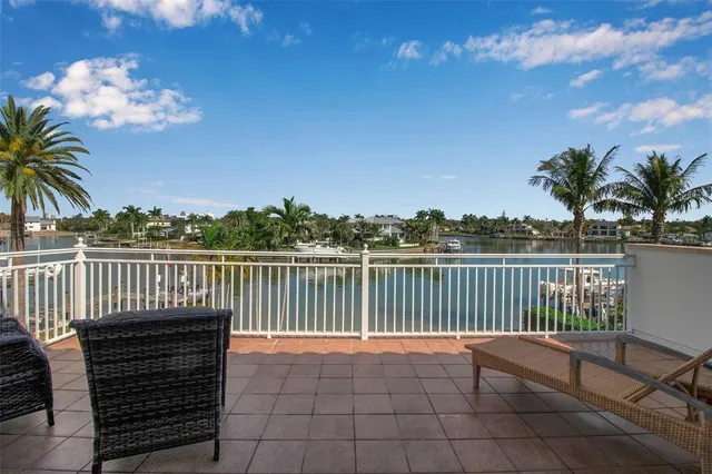 a view of a lake with a swimming pool and a outdoor space