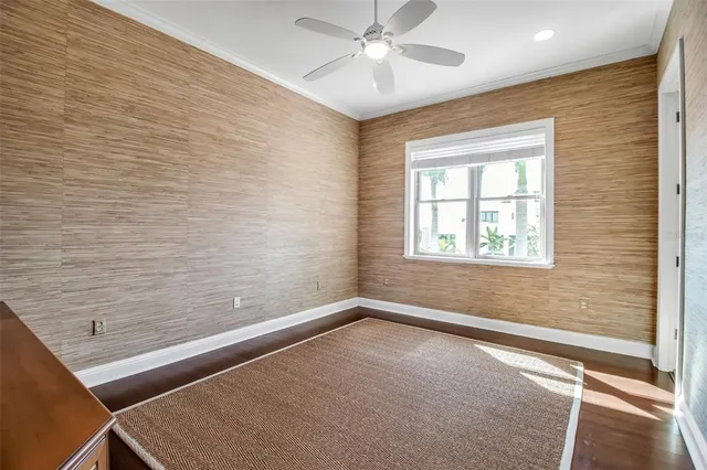 a dining room with furniture a rug and a large window