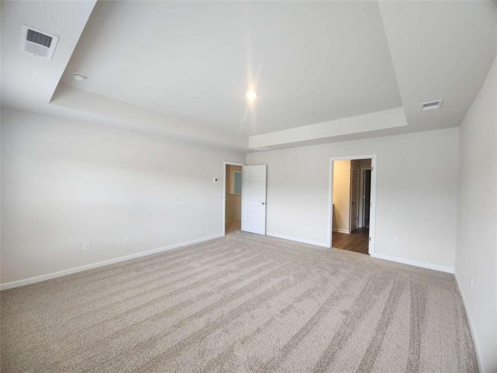 146 Aster Avenue Locust Grove, GA 30248 - Photo 12 of 28 a view of an empty room and window