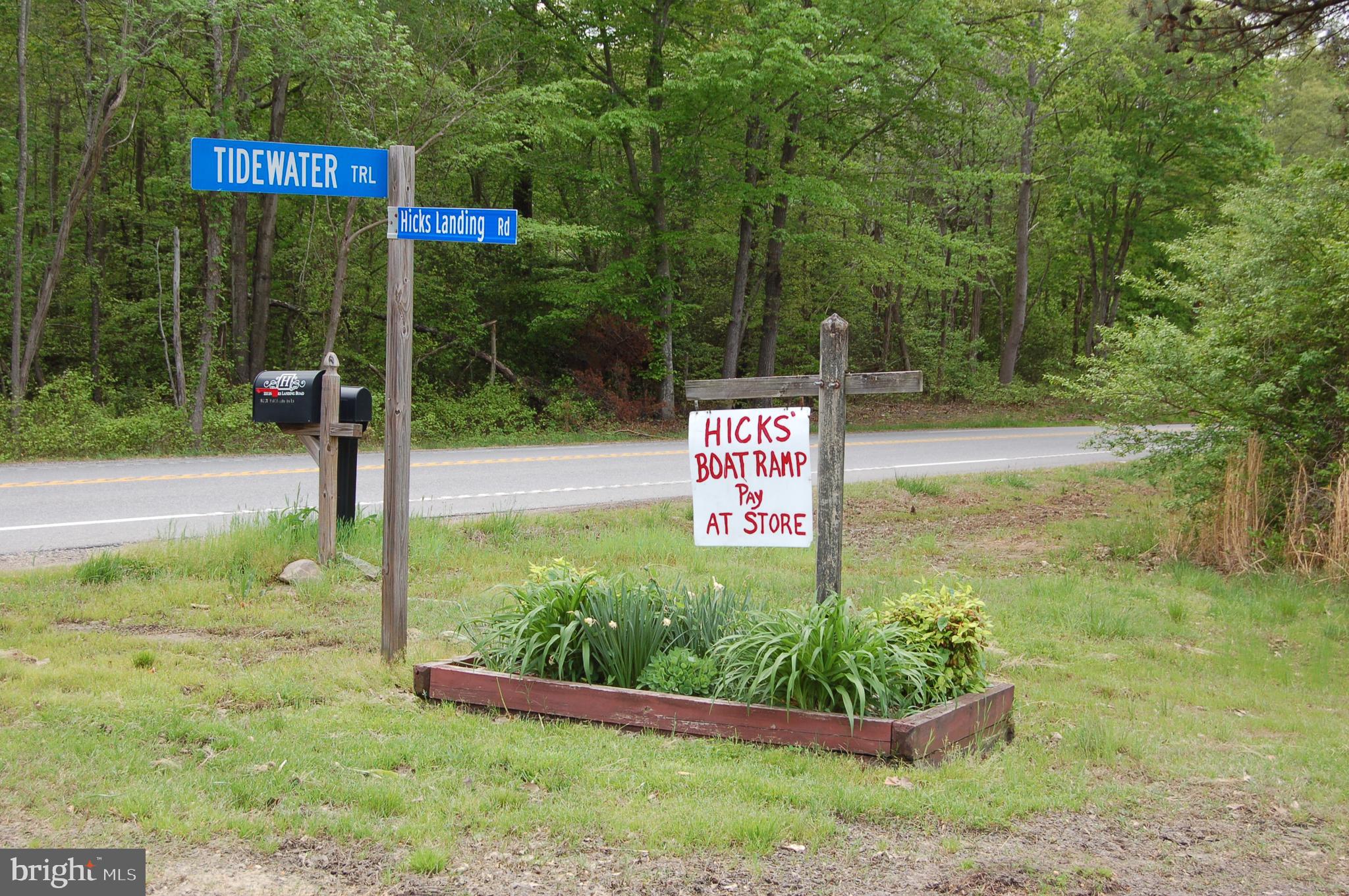 0 Tidewater Trail Rappahannock Academy, VA 22538 - Photo 16 of 64 a sign that is sitting in front of flowers