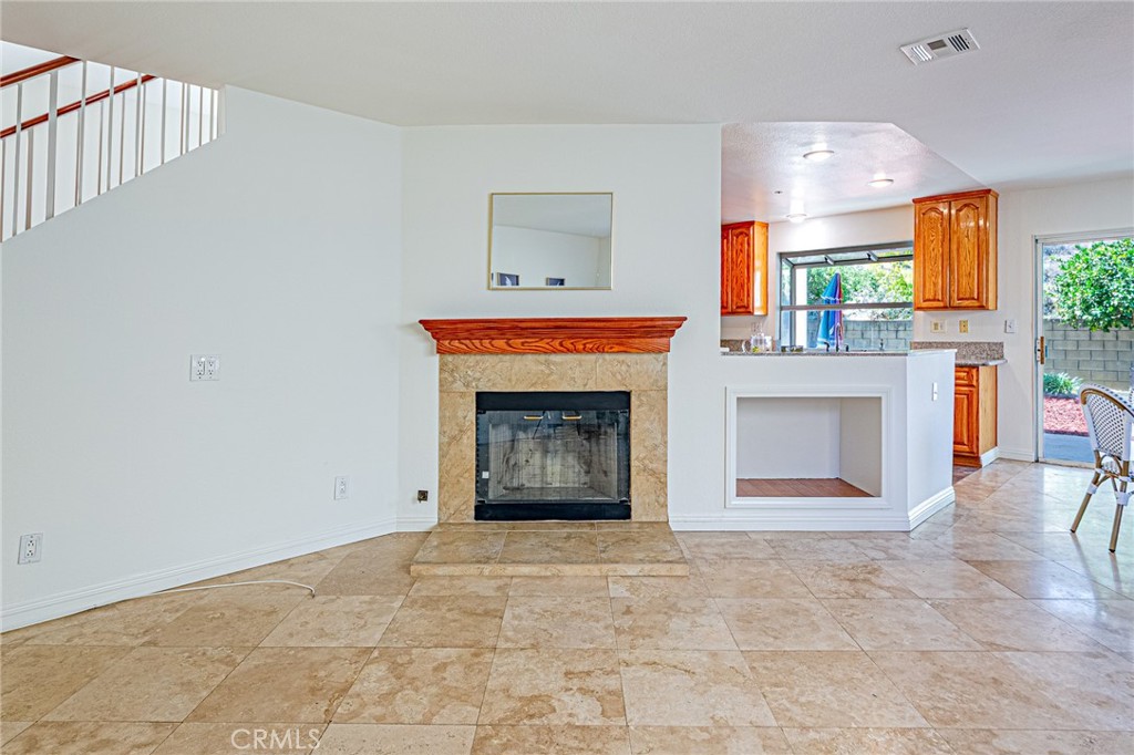 15377 Tobarra Road Fontana, CA 92337 - Photo 13 of 38 Cozy family room with a charming fireplace