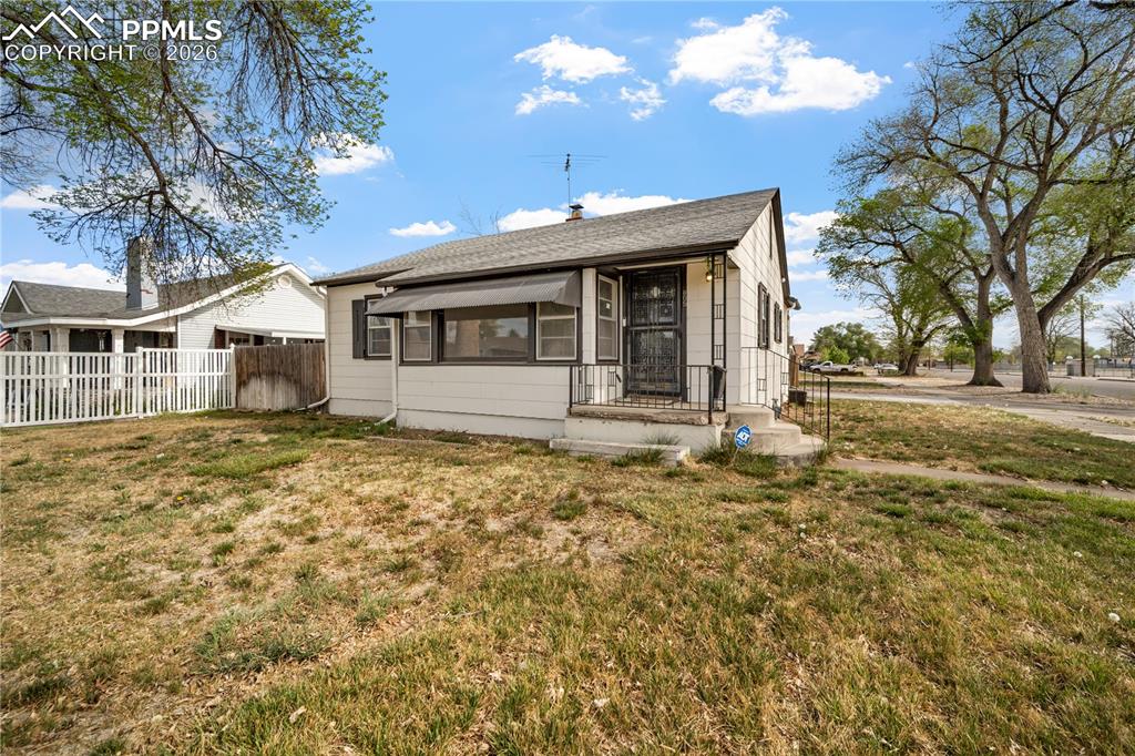 805 West Routt Avenue Pueblo, CO 81004 - Photo 1 of 27 a front view of a house with a yard
