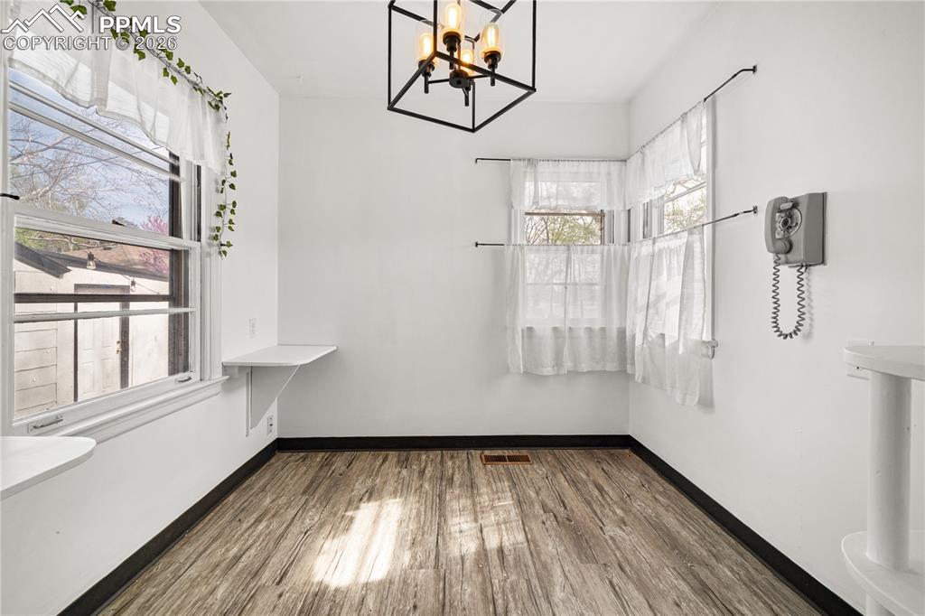 805 West Routt Avenue Pueblo, CO 81004 - Photo 11 of 27 a view of small space with wooden floor and windows
