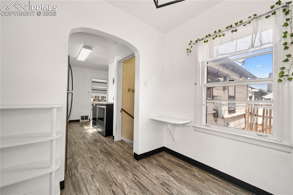 805 West Routt Avenue Pueblo, CO 81004 - Photo 12 of 27 a view of a hallway view with wooden floor and staircase
