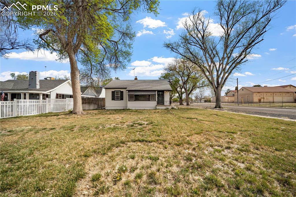 805 West Routt Avenue Pueblo, CO 81004 - Photo 2 of 27 a house with trees in front of it