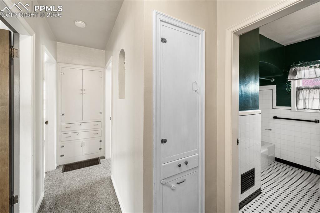 805 West Routt Avenue Pueblo, CO 81004 - Photo 5 of 27 a view of a hallway with wooden floor and closet
