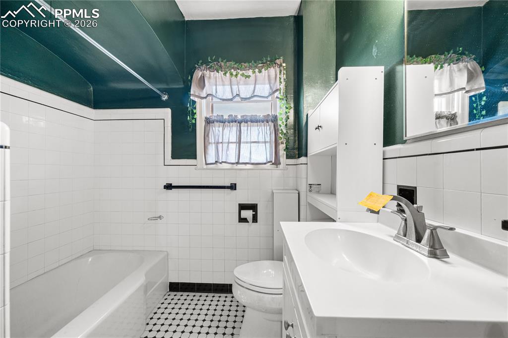 805 West Routt Avenue Pueblo, CO 81004 - Photo 6 of 27 a bathroom with a sink toilet and shower
