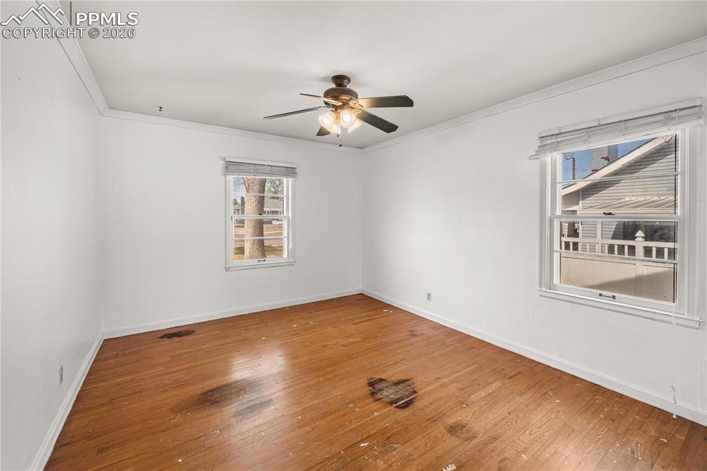 805 West Routt Avenue Pueblo, CO 81004 - Photo 9 of 27 a view of empty room with wooden floor and fan