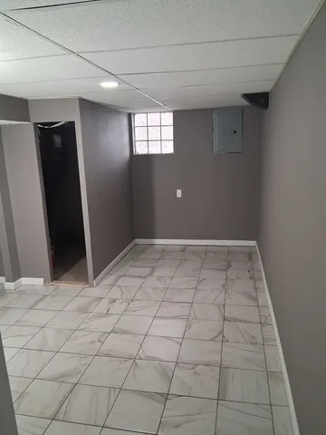 a view of an empty room and window