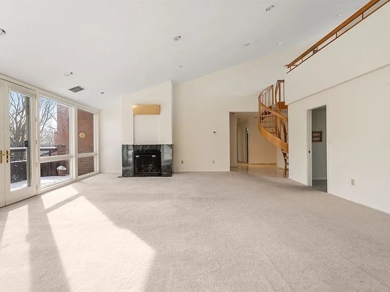 241 Perkins Street, Unit D605 Boston, MA 02130 - Photo 6 of 10 a view of a livingroom with furniture and an empty room