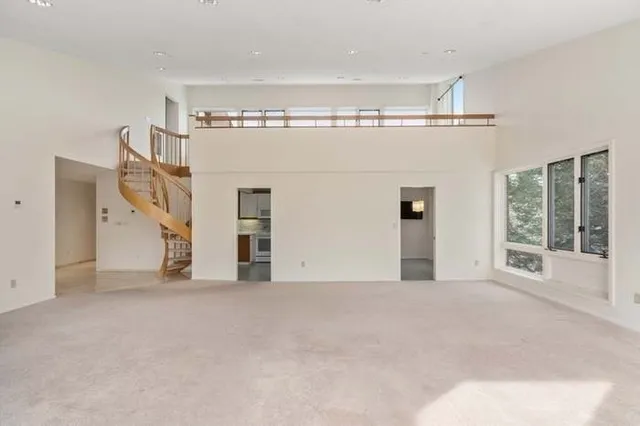 a view of empty room with windows