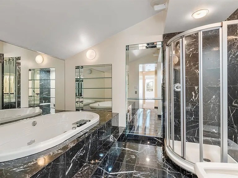 241 Perkins Street, Unit D605 Boston, MA 02130 - Photo 9 of 10 a bathroom with a tub a double vanity sink and glass door