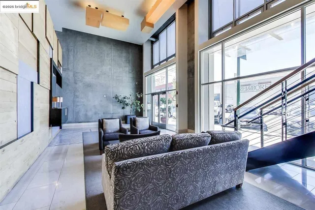 a living room with furniture a window and a rug