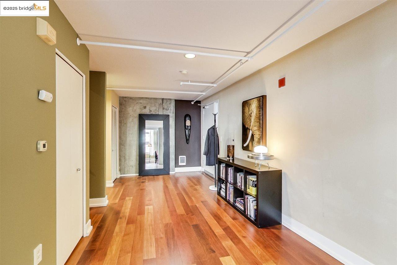 311 Oak Street, Unit 337 Oakland, CA 94607 - Photo 16 of 38 a view of a hallway with wooden floor and staircase