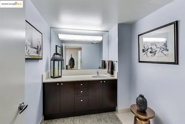 a en suite bathroom with a toilet a sink and mirror