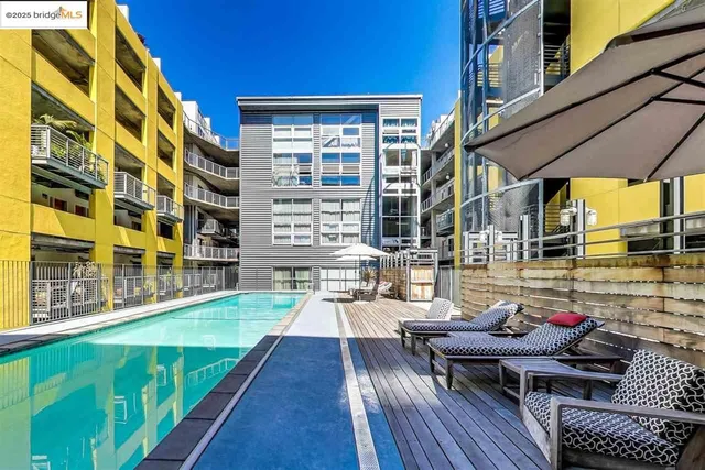 a room with pool table and windows