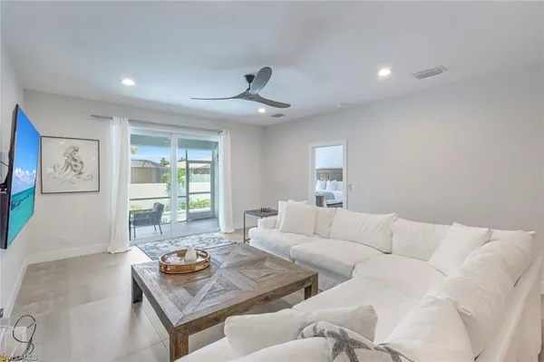 a living room with furniture and a large window