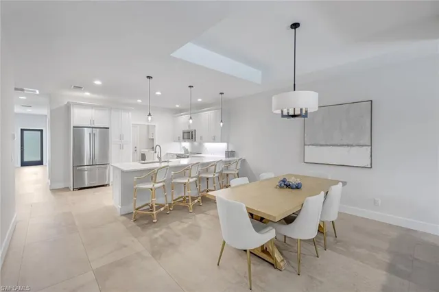 a view of a dining room and livingroom with furniture