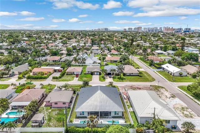 a aerial view of a house with a yard