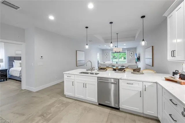a kitchen with a sink and cabinets