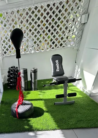 a living room with furniture and a lamp