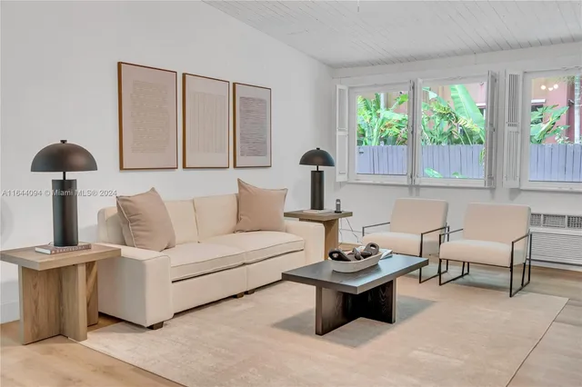 a large kitchen with stainless steel appliances kitchen island granite countertop a large counter top and outdoor space