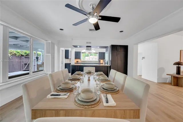 a bedroom that has a bed and a painting on the wall