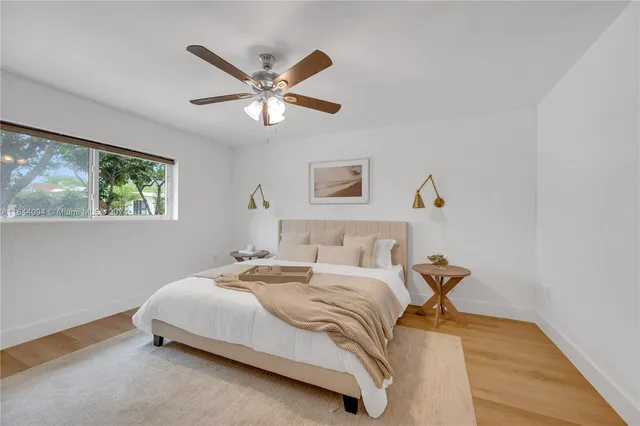 a view of a house with swimming pool and sitting area