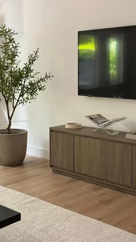 a view of a house with swimming pool and sitting area