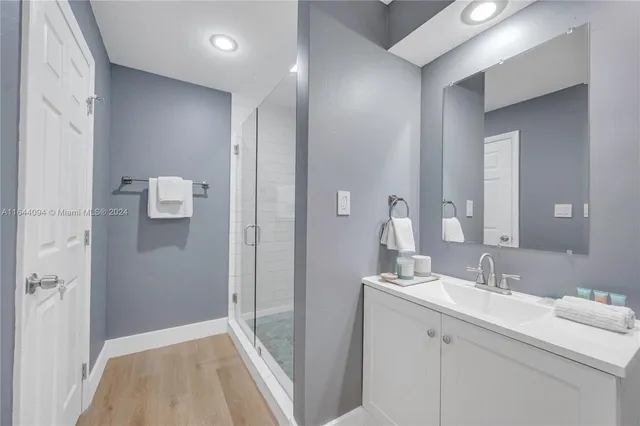 a view of a patio with table and chairs and wooden floor