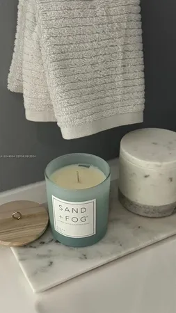 a living room with furniture and a lamp