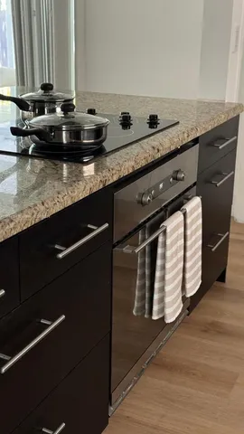 a living room with furniture and a lamp