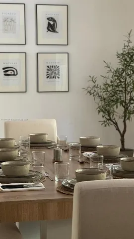 a bedroom with two beds and a large window