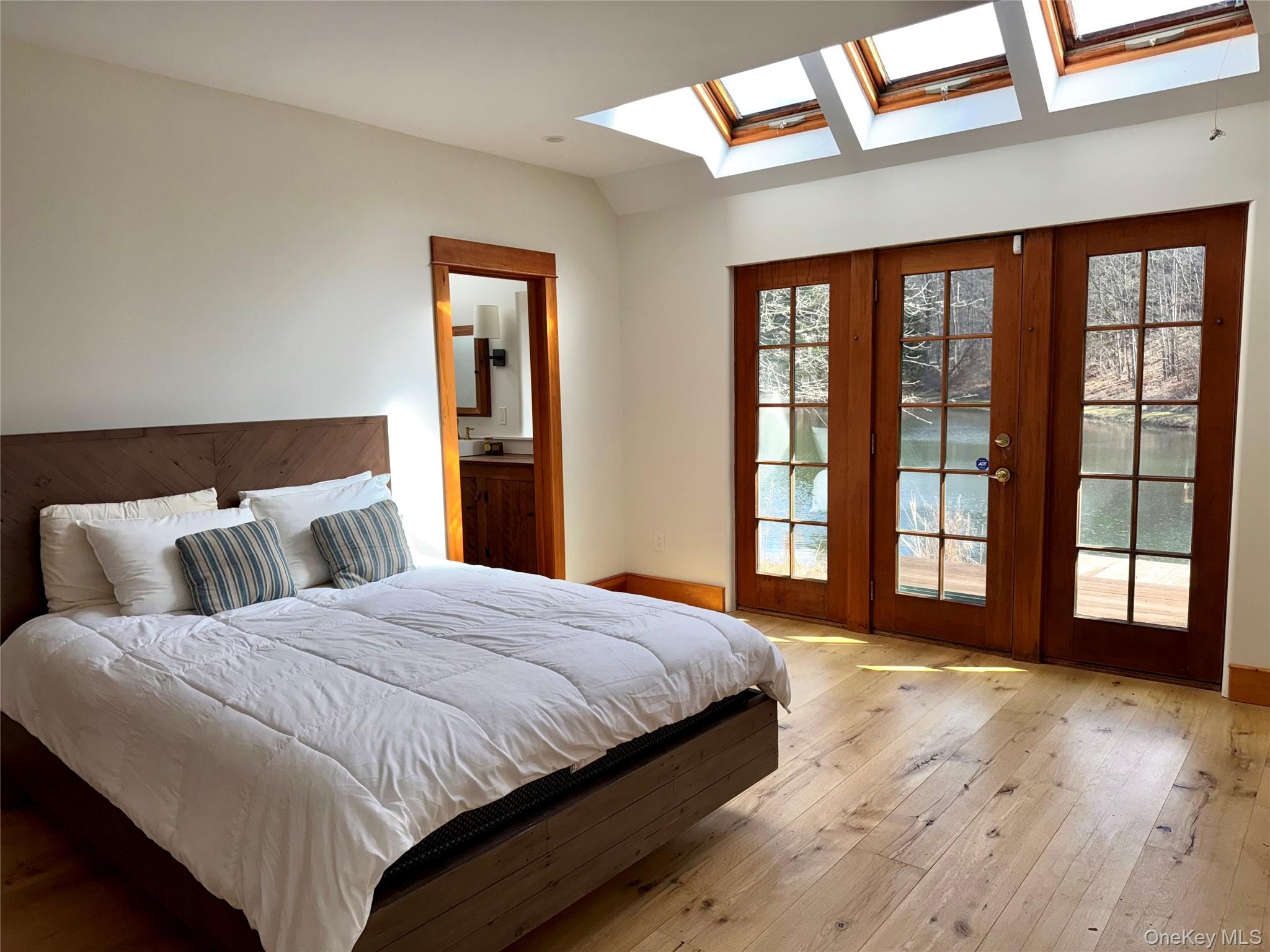 22 Knight Road Clinton Corners, NY 12514 - Photo 25 of 34 Primary Bedroom with Pine Floors, Vaulted Ceiling, Skylights & Screened Porch