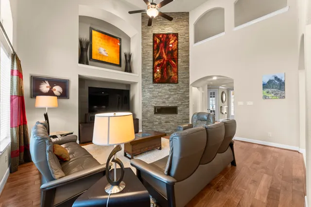 a living room with furniture and a fireplace