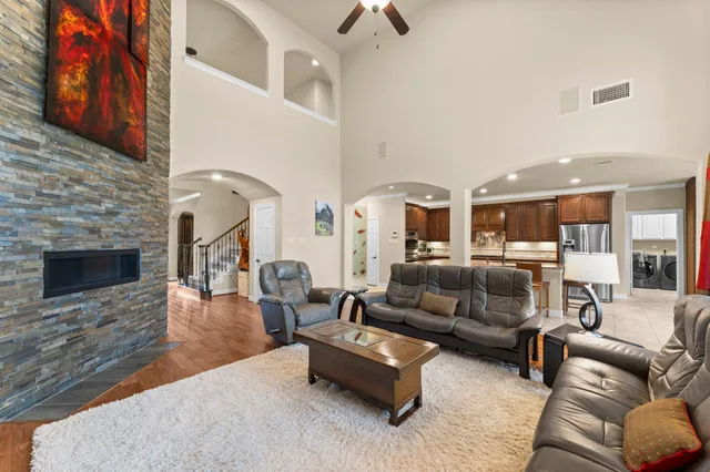 a living room with furniture and a fireplace