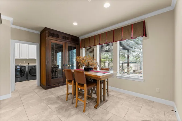 a view of a dining room with furniture window and outside view