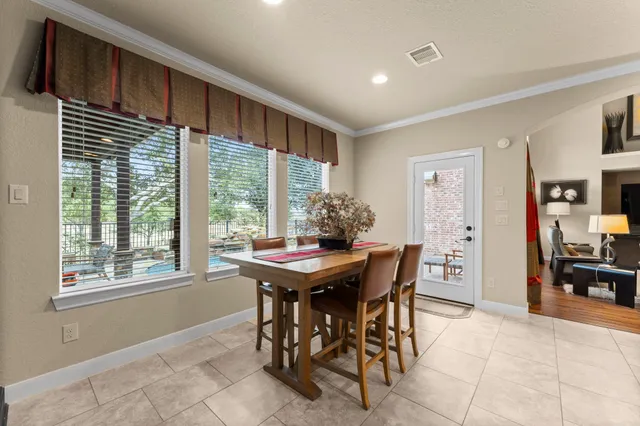 a view of a dining room with furniture window and outside view