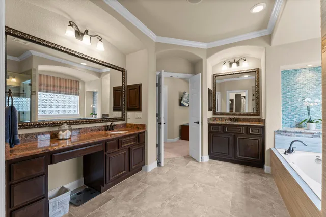 a large kitchen with a stove and cabinets