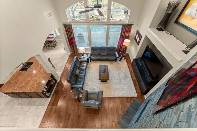 a view of living room with furniture and a fireplace