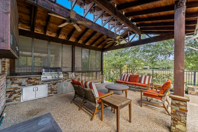 a outdoor space with lots of furniture and iron fence