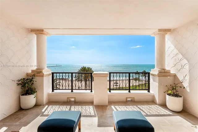 a living room with furniture and potted plant
