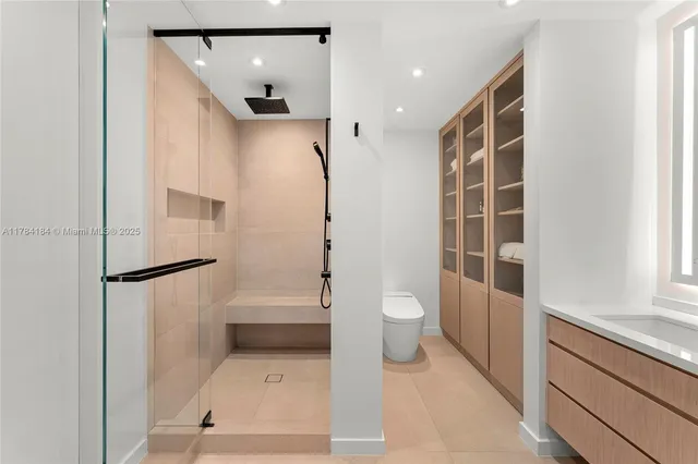 a bathroom with a shower and a toilet