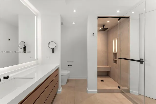 a bathroom with a shower and a toilet