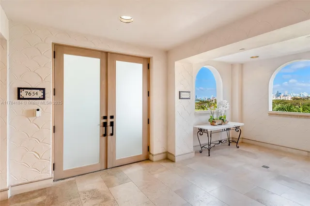 a view of a livingroom with furniture and windows