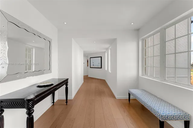 a view of a livingroom with furniture and a window
