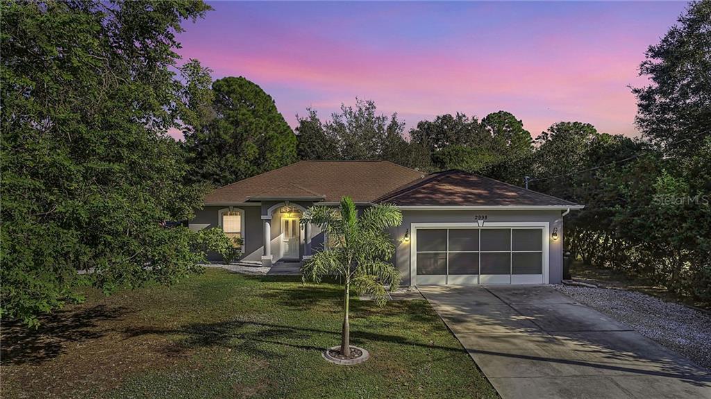 2998 Embassy Road North Port, FL 34291 - Photo 1 of 1 a front view of a house with a yard and garage