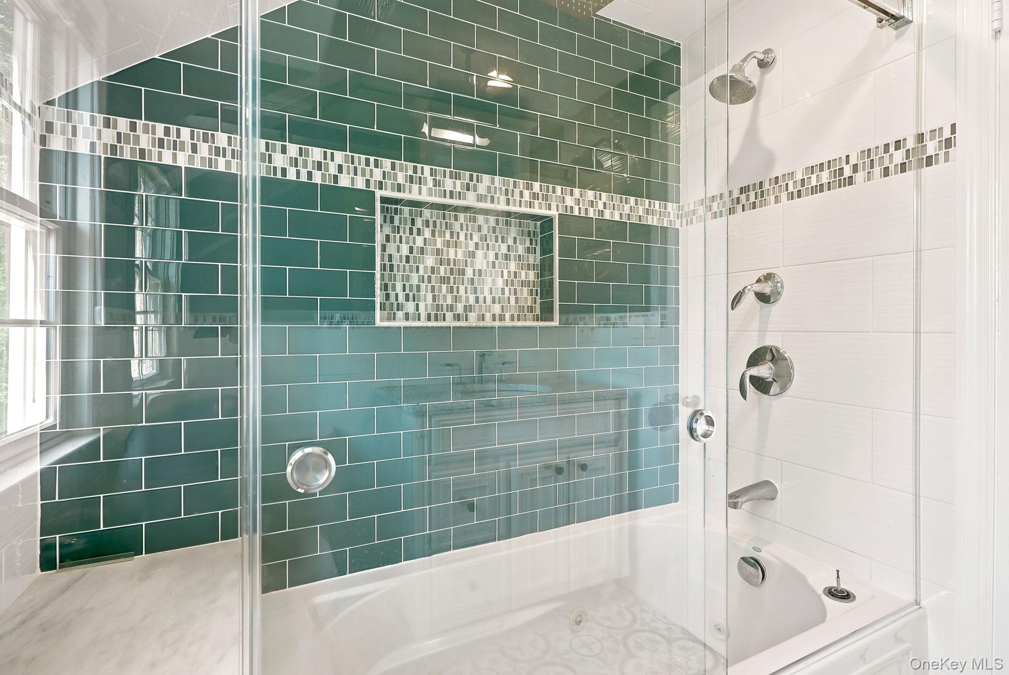 1 Sheridan Road Scarsdale, NY 10583 - Photo 29 of 40 Tub/shower combination in second floor hall bath featuring a jetted tub and lovely tile work