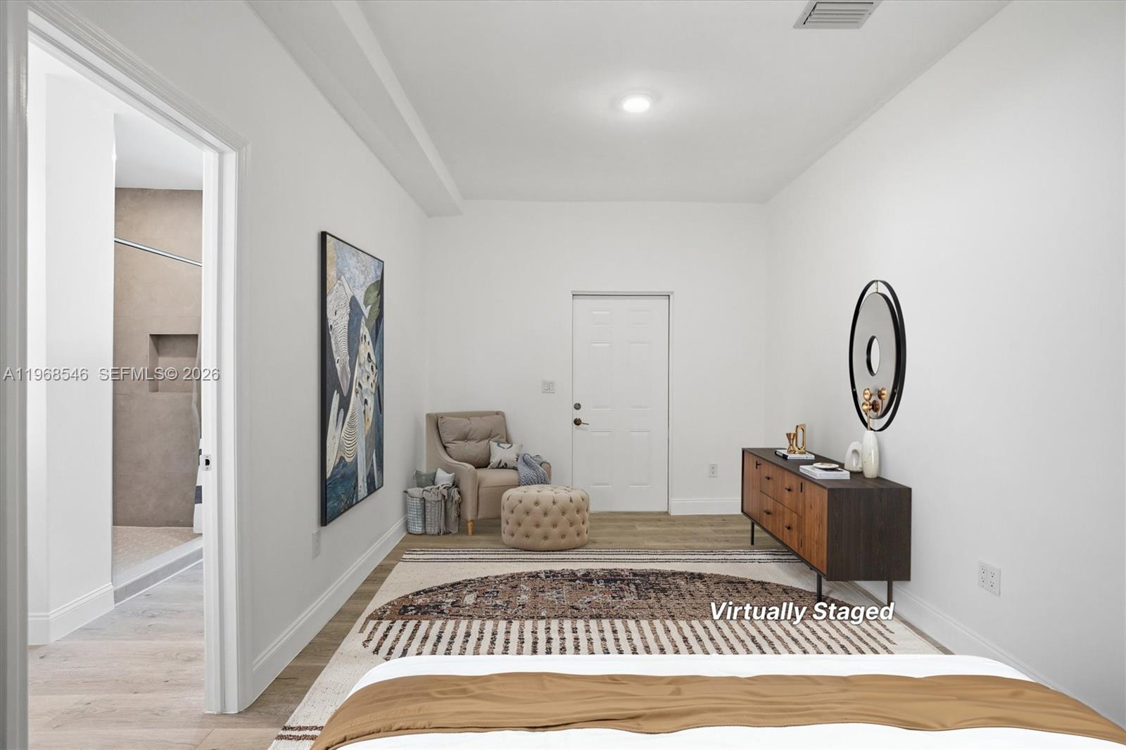 4237 Southwest 7th Street Miami, FL 33134 - Photo 11 of 31 a view of a bedroom with a rug and wooden floor